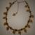 Regina   glass leaves necklace (her 1st piece!!)
  Glass beads, amber color, great      for fall, simple, but pretty.   
19" w/ 4" gold extender          
   Matching earrings avilable 
           JE10002
JN10001    $18.00   