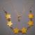 Starry Glow necklace
Warm yellow Stone star shaped beads with pale amber clear colored glass beads, on a gold chain with extender. 15 inch

JN90062  $18.00