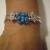 Turquoise chip bangle style bracelet, with two rows of silver tube beads, crystal spacers, and a fold-over magnet clasp.  $25.00