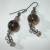 Large Smoky Quartz beads, 12 mm, with peach tone glass chip rondell spacers, and scroll wire wrapped dangles. They have an antique/vintage feel but are new. These wires are black but can easily be changed by request.  $17.00